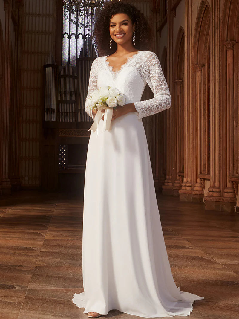 White wedding dress with long sleeves and laced back.